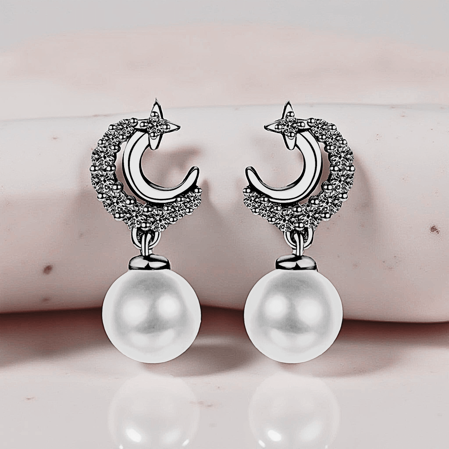 Lunetta Drops - Moissanite Pearl Earrings in 925 sterling silver. Featuring a silver crescent design with freshwater pearls.