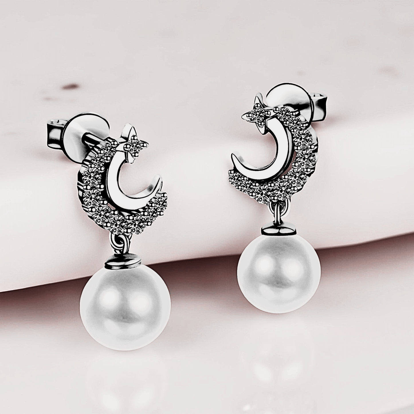 Lunetta Drops - Moissanite Pearl Earrings in 925 sterling silver. Featuring a silver crescent design with freshwater pearls.