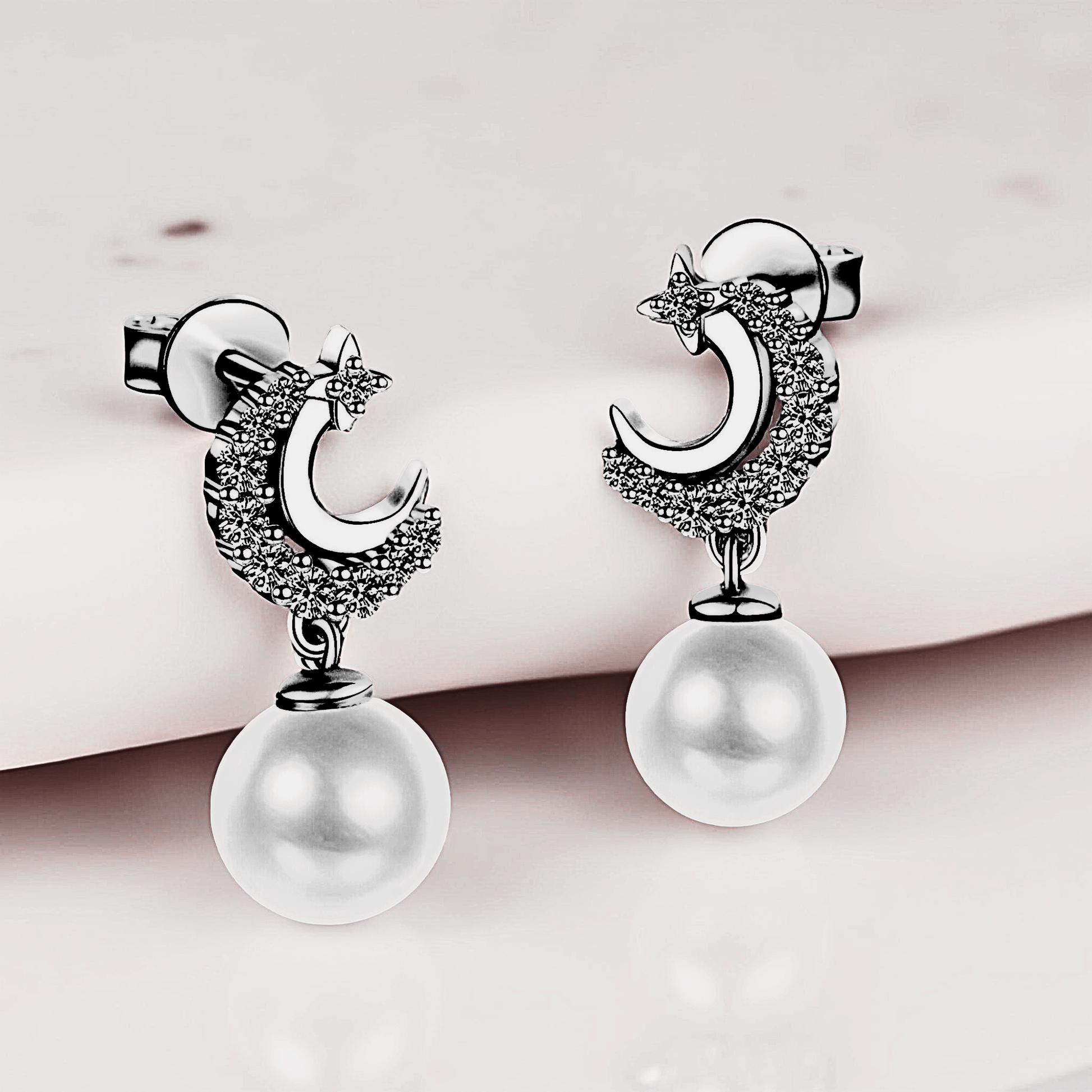 Lunetta Drops - Moissanite Pearl Earrings in 925 sterling silver. Featuring a silver crescent design with freshwater pearls.