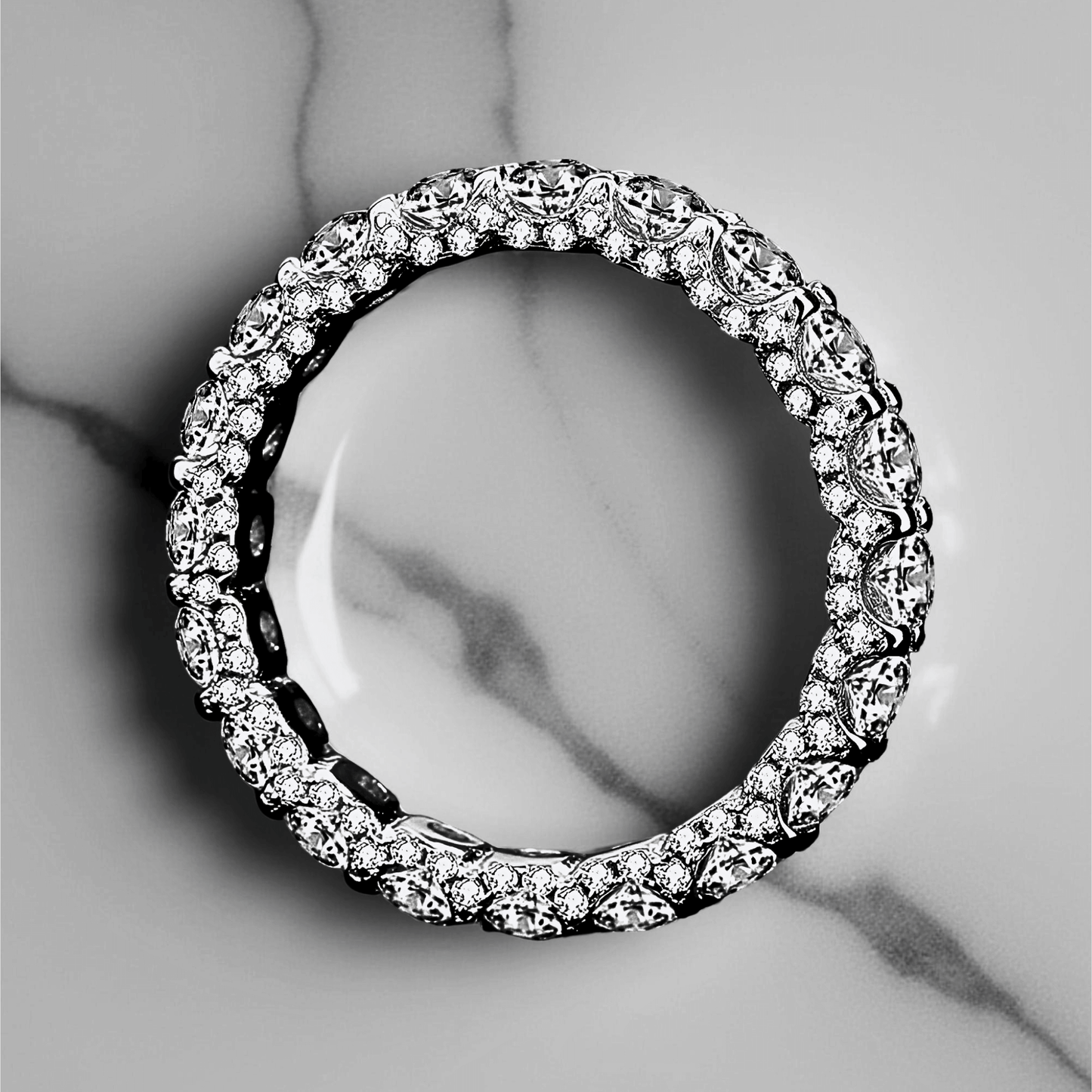 Orbit Band 2.1ct - Moissanite eternity Ring made from 925 sterling silver, rhodium plating, and 2.1 carats of white moissanite.