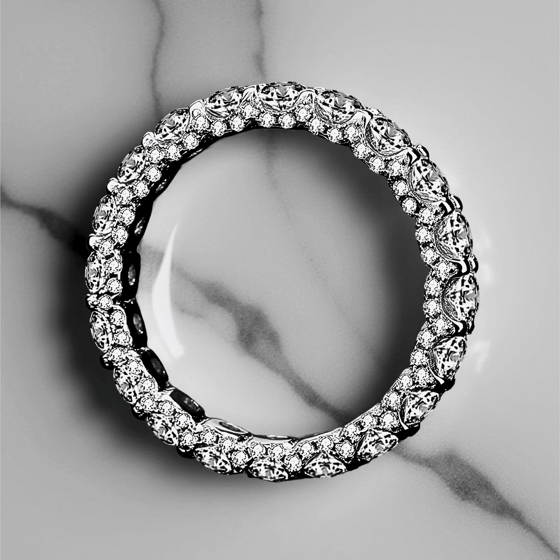 Orbit Band 2.1ct - Moissanite eternity Ring made from 925 sterling silver, rhodium plating, and 2.1 carats of white moissanite.