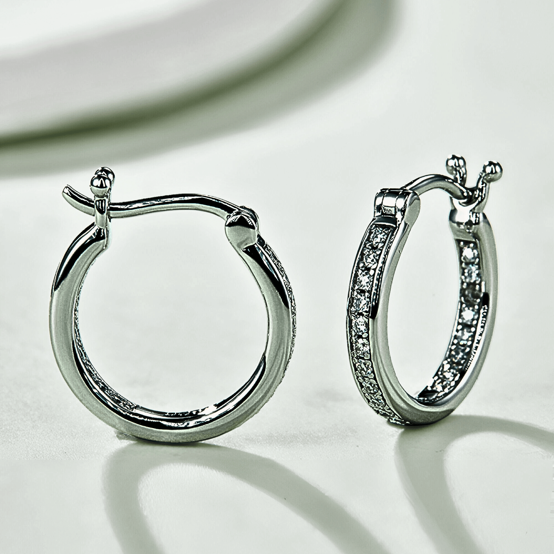 Tallis Hoops - silver moissanite earrings in a hoop design. made from 925 sterling silver.