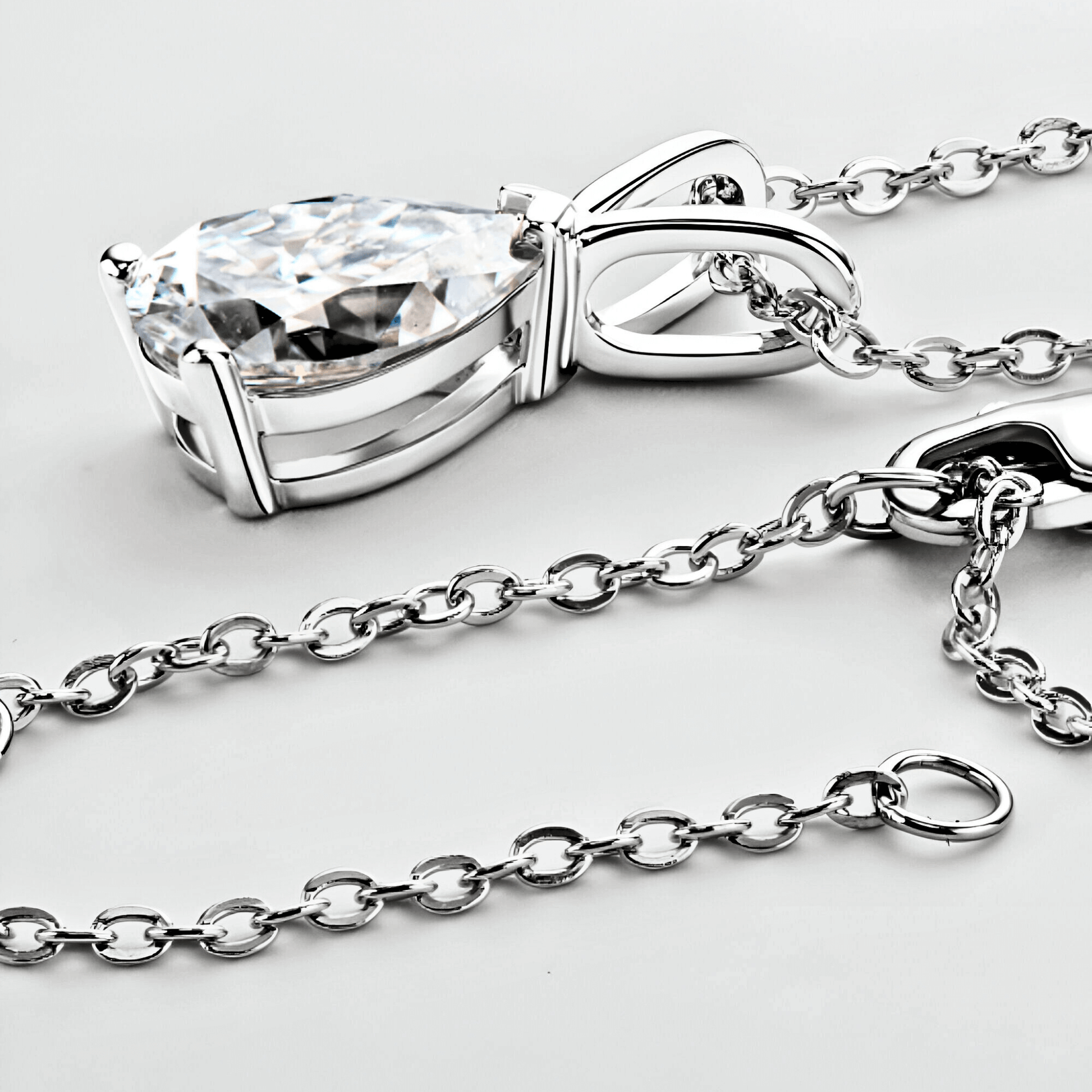 close up of the Mira Pendant 1.5ct - Teardrop necklace in polished 925 sterling silver with 1.5 carats of white moissanite.