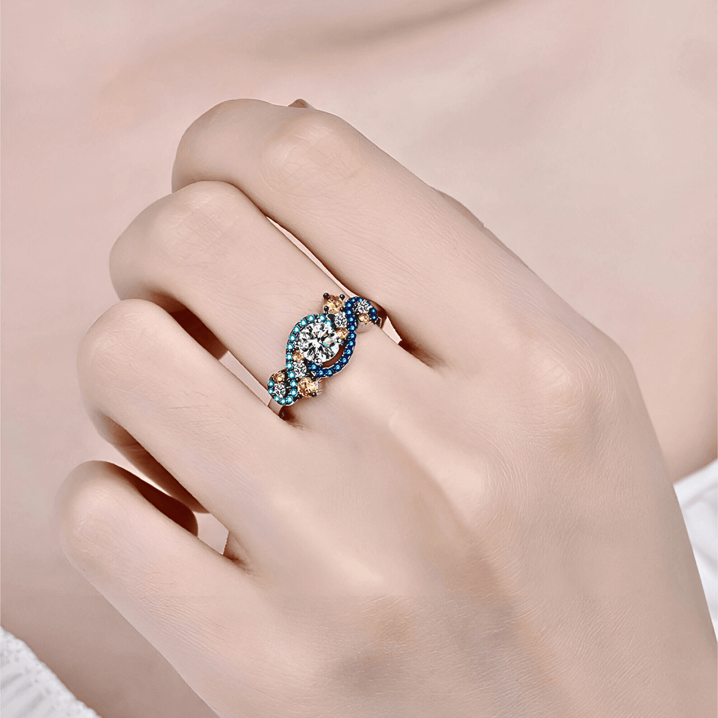 model wearing the Gaia Ring 0.5ct -  925 sterling silver Moissanite Ring featuring vibrant blue and orange zircon accents.