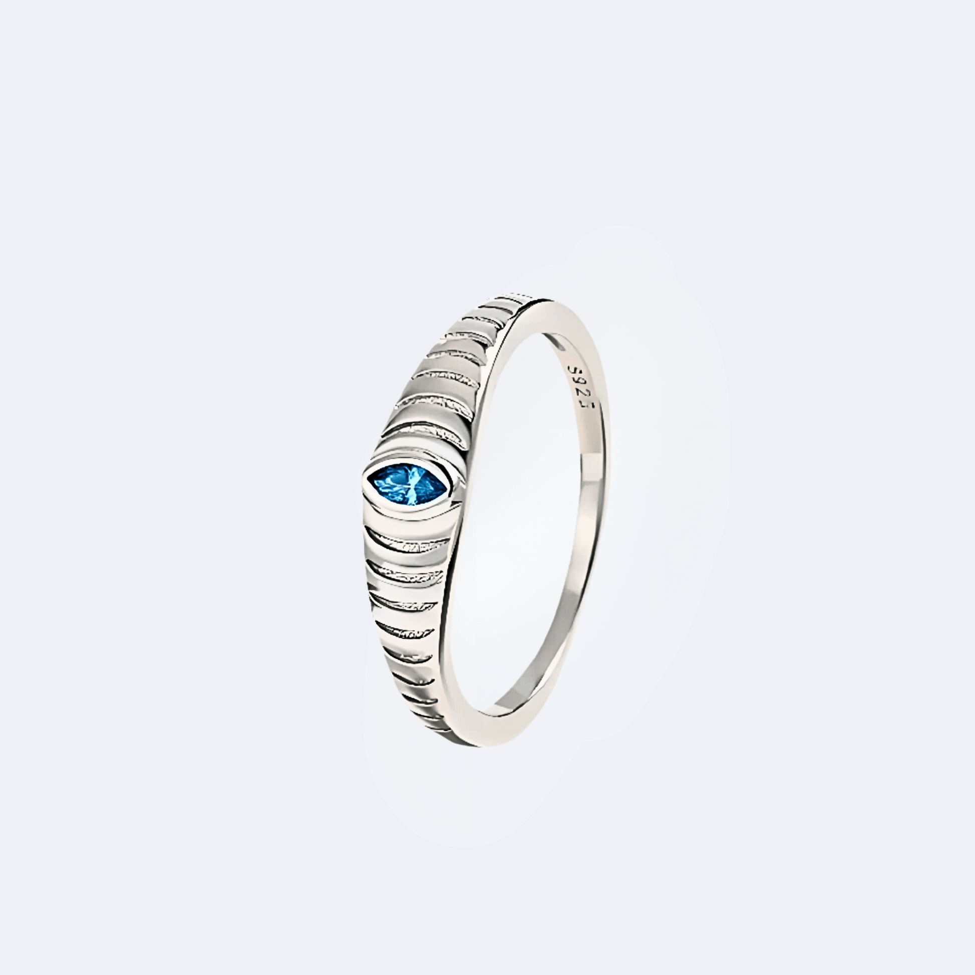 Iridian Band in 925 Sterling Silver featuring a blue zircon marquise cut and etched design.