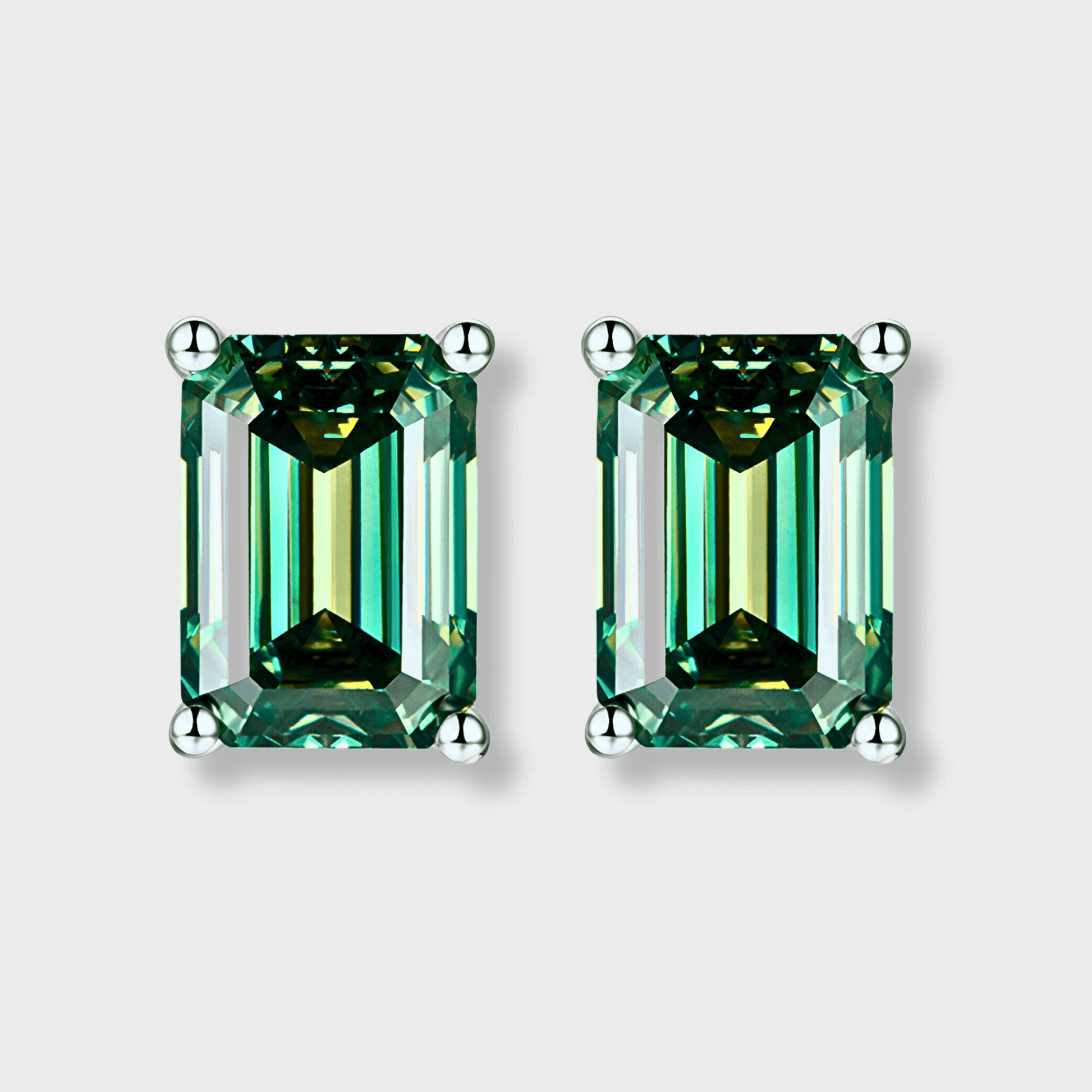Juniper Studs – 2ct Green Moissanite Earrings in 925 sterling silver with elegant emerald cut design.