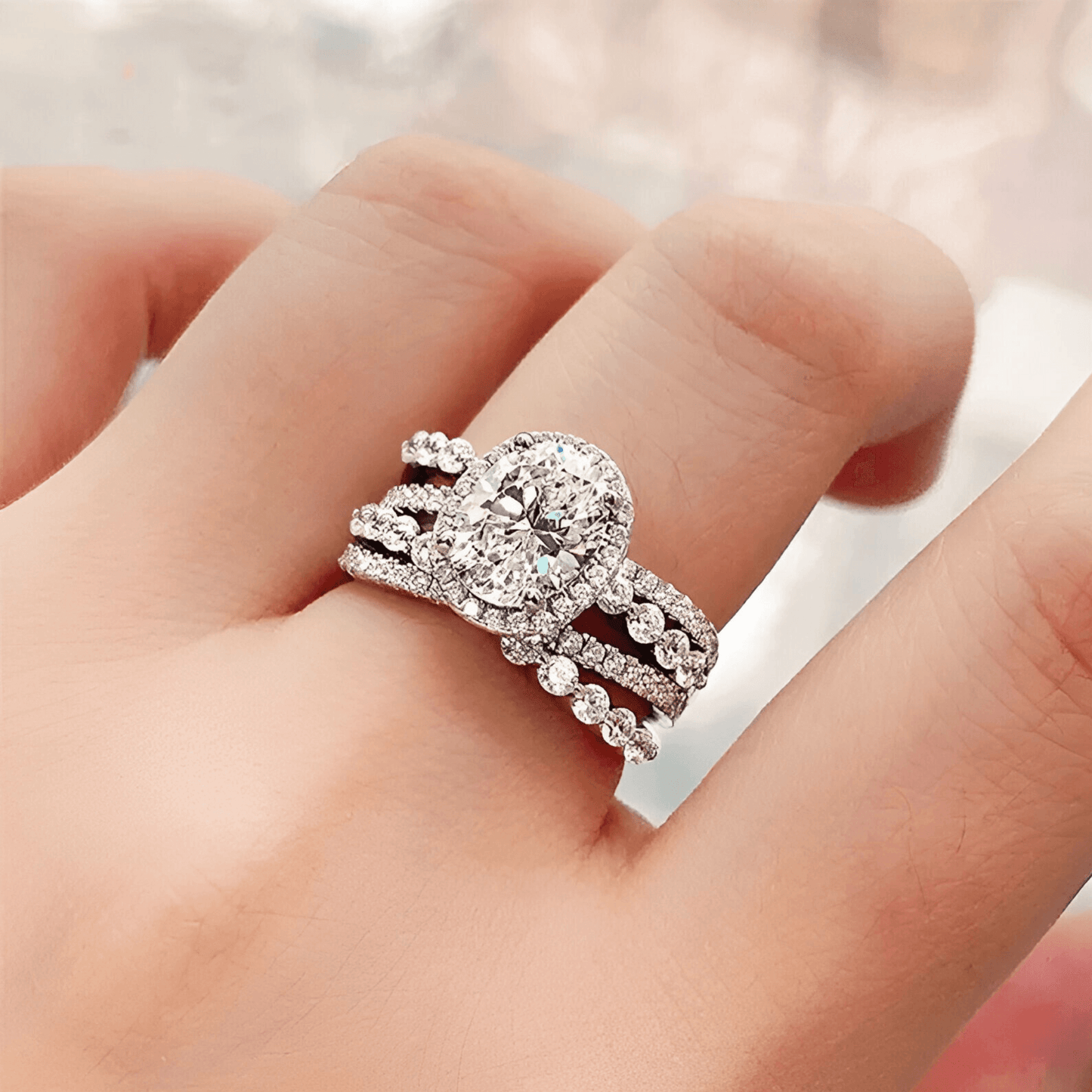 modeal wearing the Trinity Ring 3ct -  a moissanite ring in 925 sterling silver, featuring a triple band design with zircon accents. | Silver Moissanite Ring