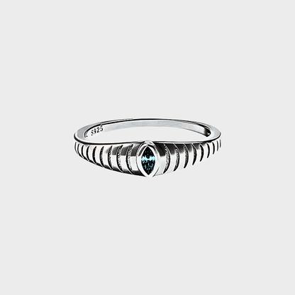 Iridian Band featuring a blue zircon in marquise cut, etched design on 925 Sterling Silver band.