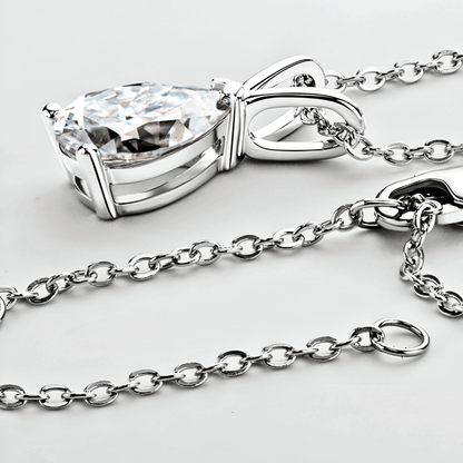close up of the Mira Pendant 1.5ct - Teardrop necklace in polished 925 sterling silver with 1.5 carats of white moissanite.