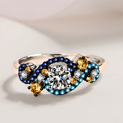 Gaia Ring 0.5ct -  925 sterling silver Moissanite Ring featuring vibrant blue and orange zircon accents.