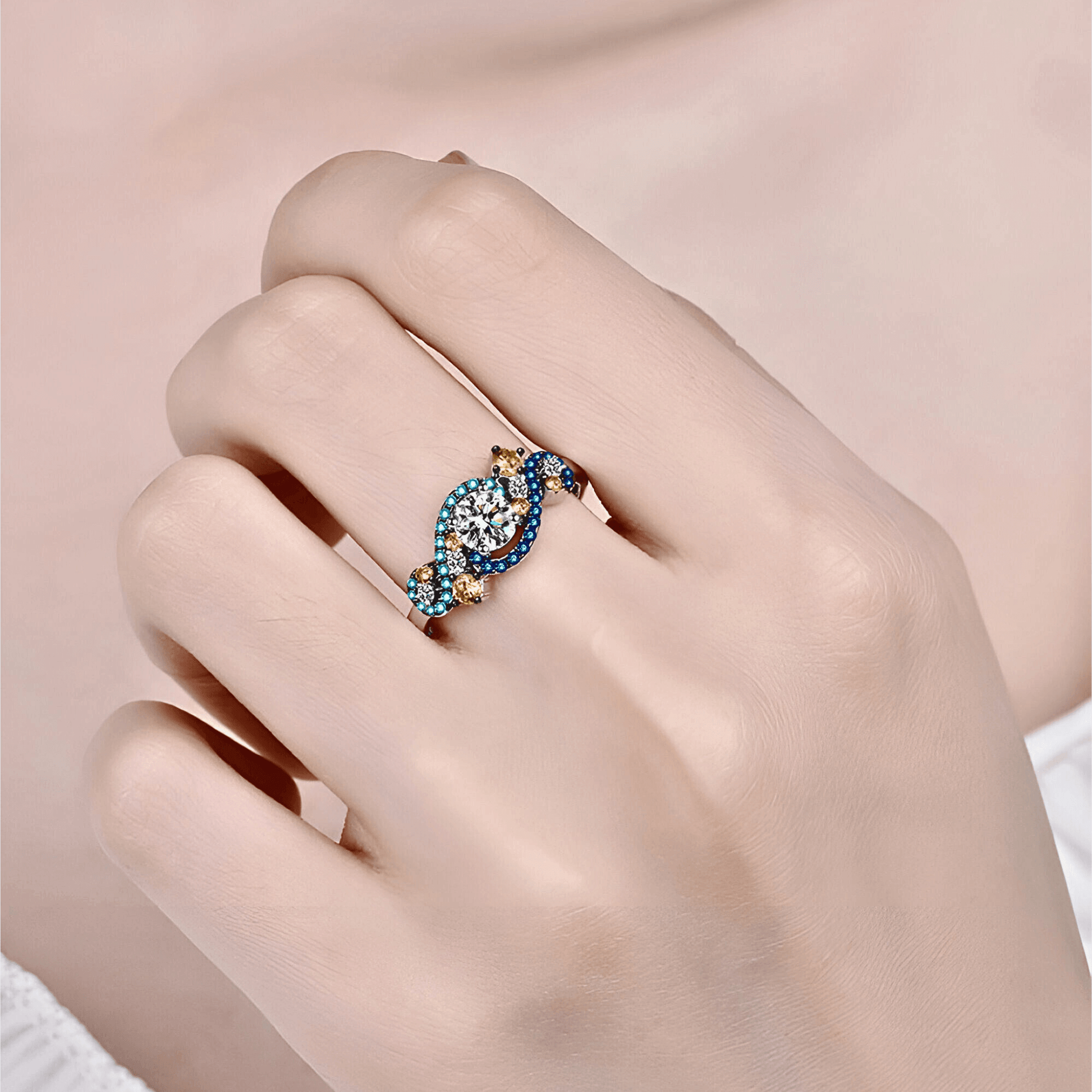 model wearing the Gaia Ring 0.5ct -  925 sterling silver Moissanite Ring featuring vibrant blue and orange zircon accents.