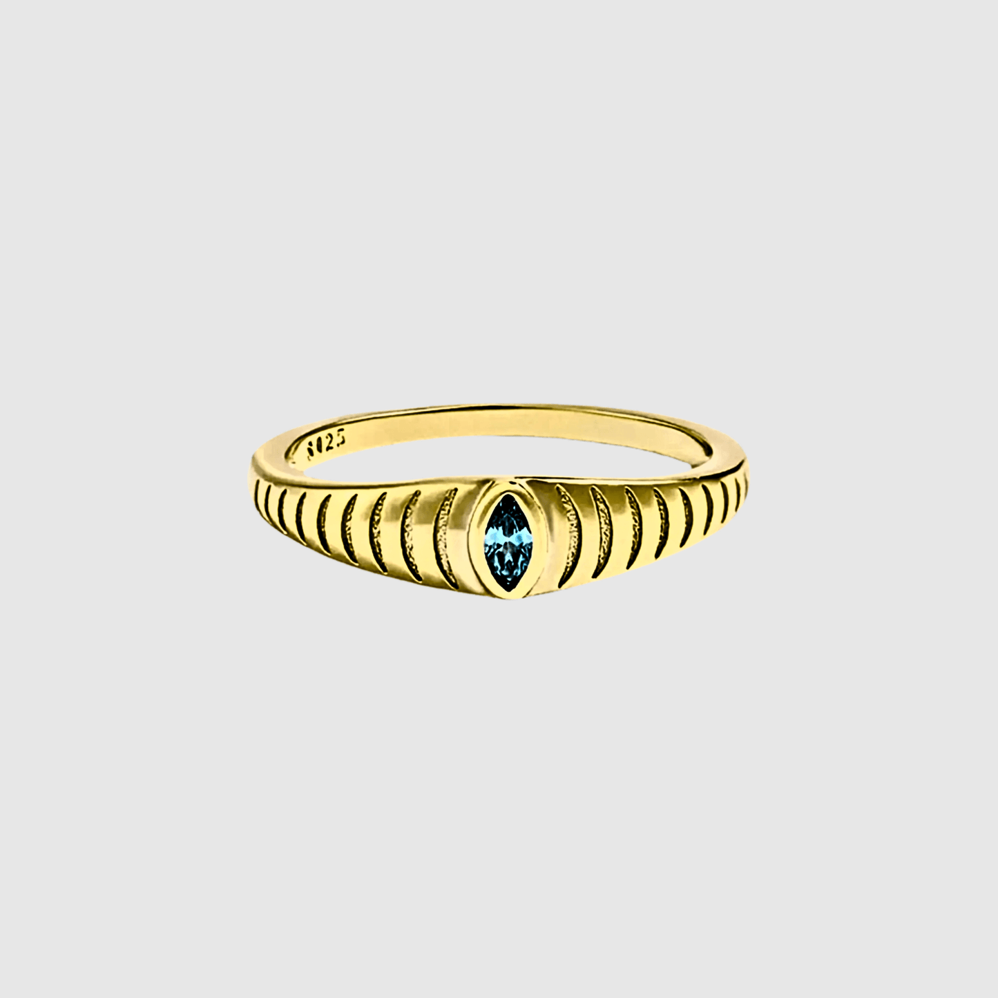 Iridian Band featuring a blue zircon marquise cut on an etched 18k gold band.
